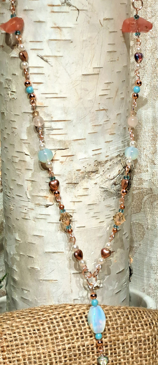 Sea shore inspired rose gold necklace and hoop earring set.