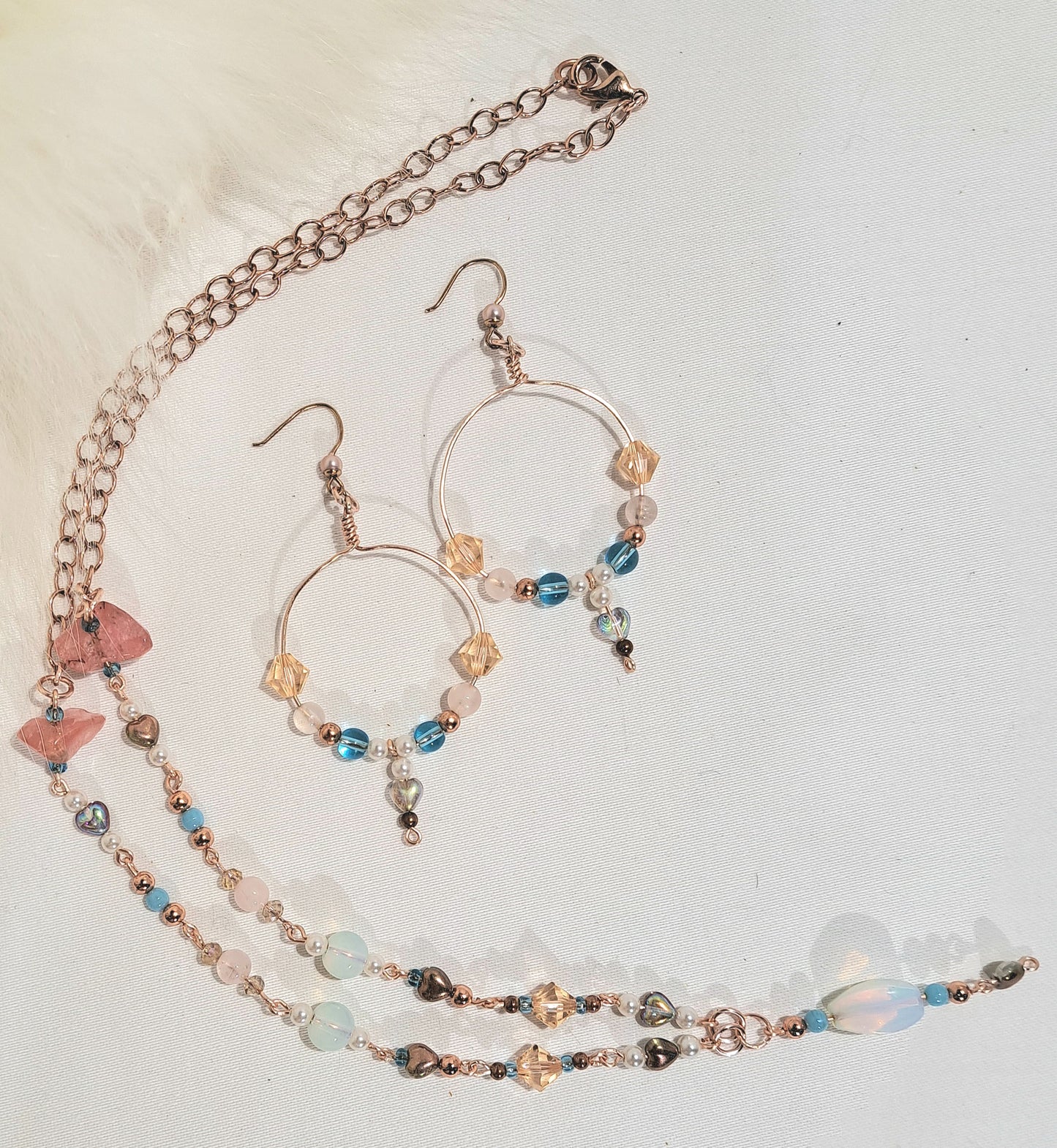 Sea shore inspired rose gold necklace and hoop earring set.