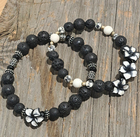 Ladies Stretch Black Lava bead and Ivory Howlite bracelet with a trio of Polymer Flowers