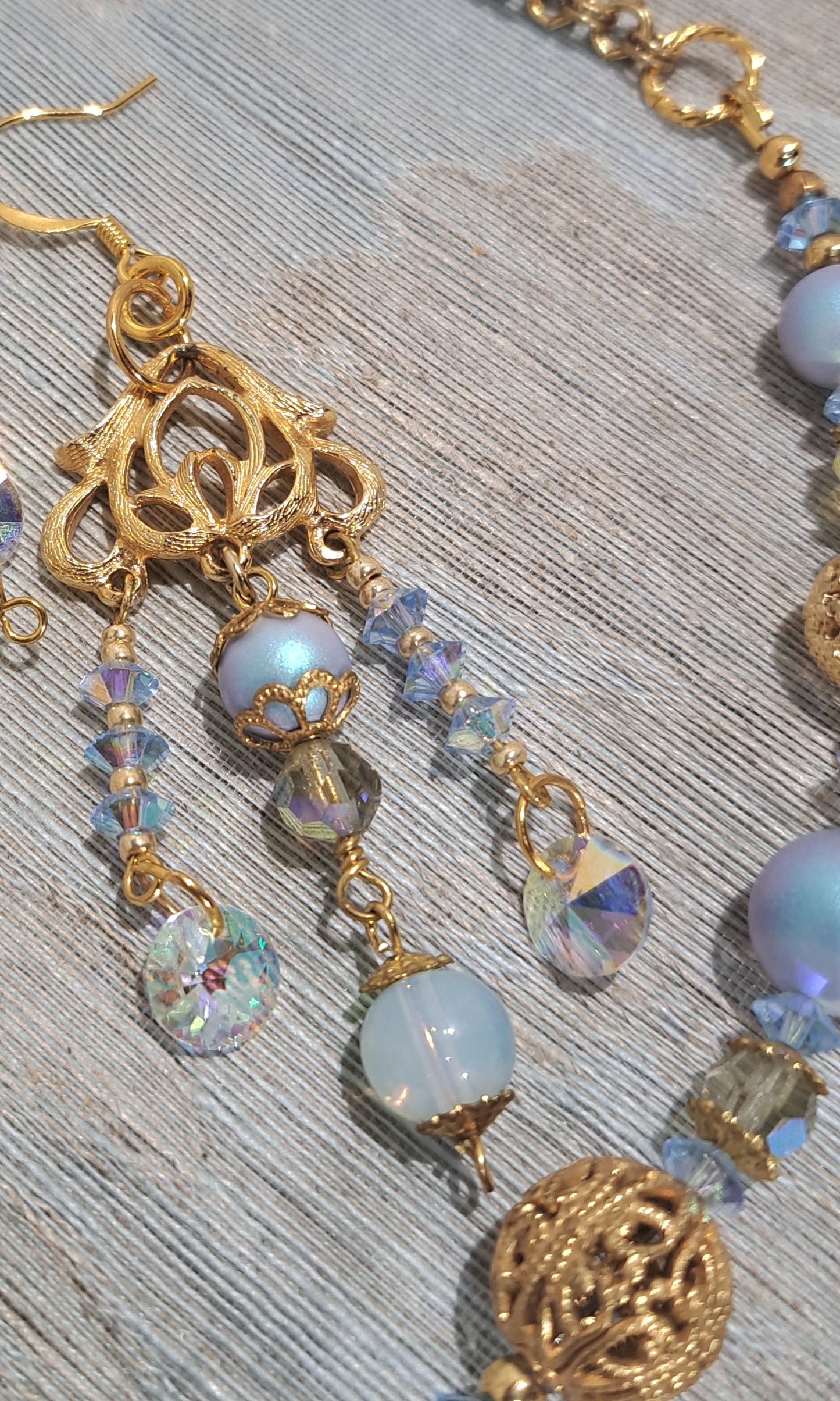 Ladies Swarovski blue pearl and vintage gold necklace and earring set.