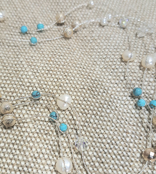 Ladies silver three strand string and bead necklace.