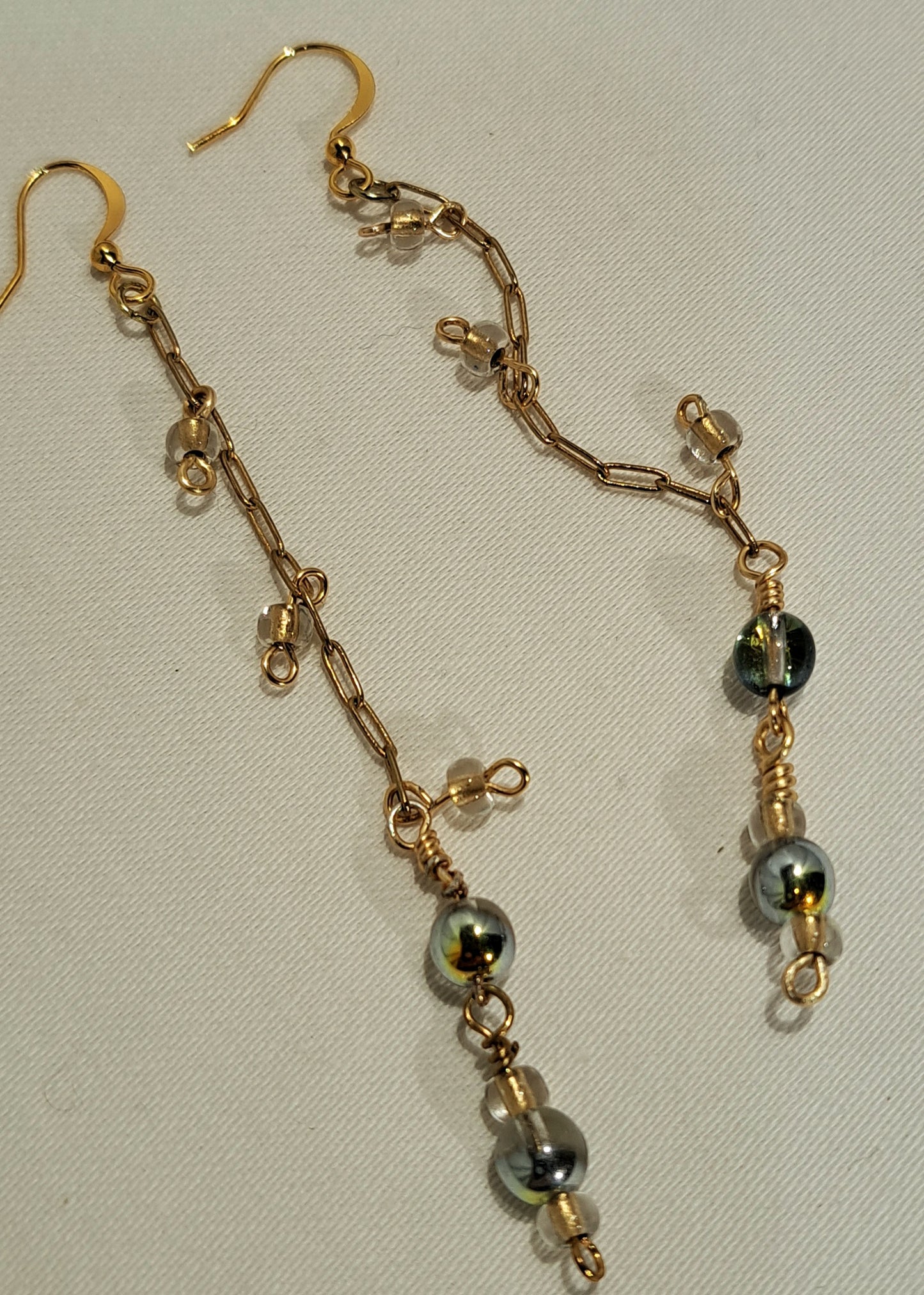 Ladies gold mini paperclip chain earrings with opaque glass.
