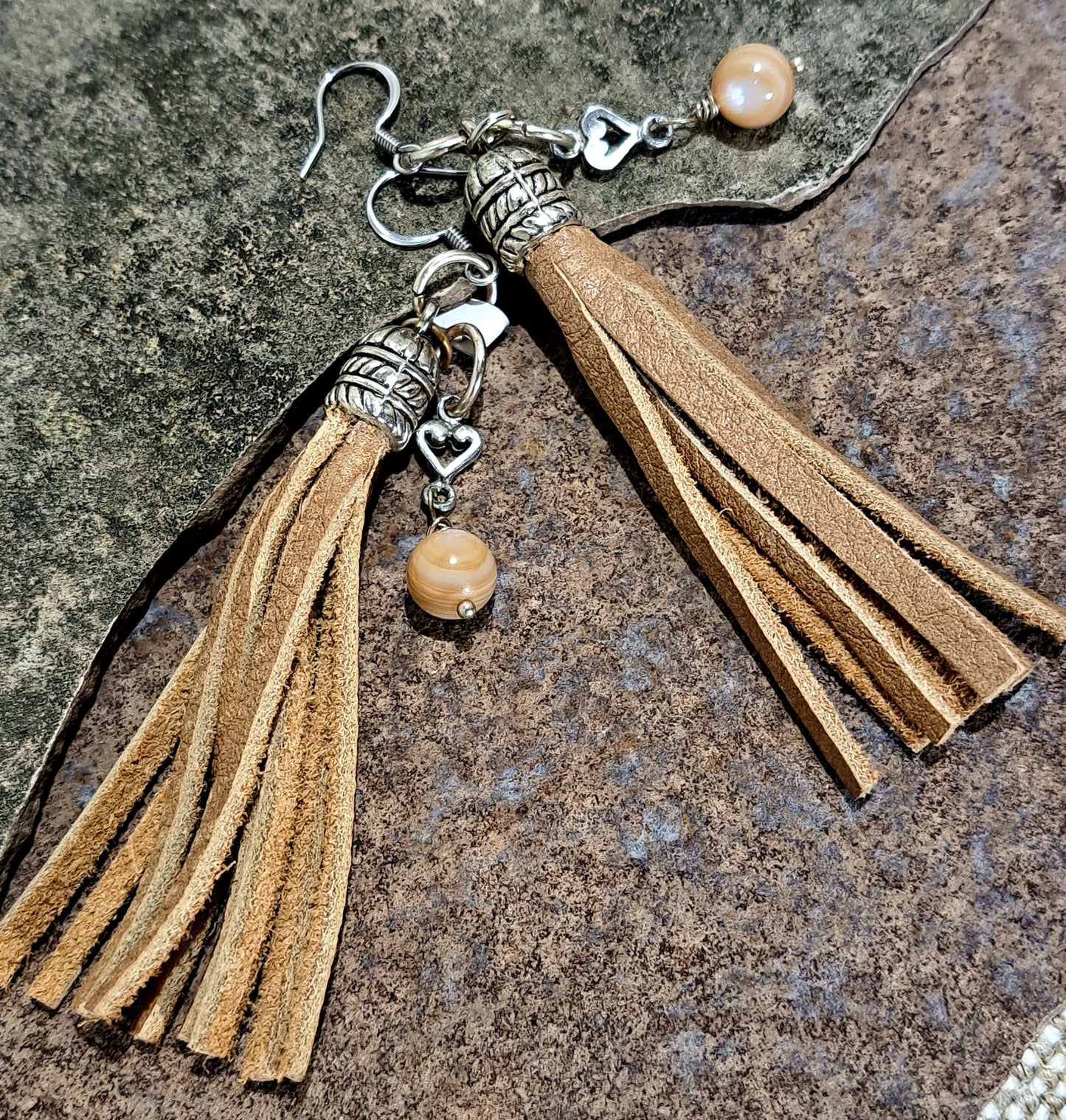 Ladies Buff coloured leather tassel earrings and stainless steel ear wires.