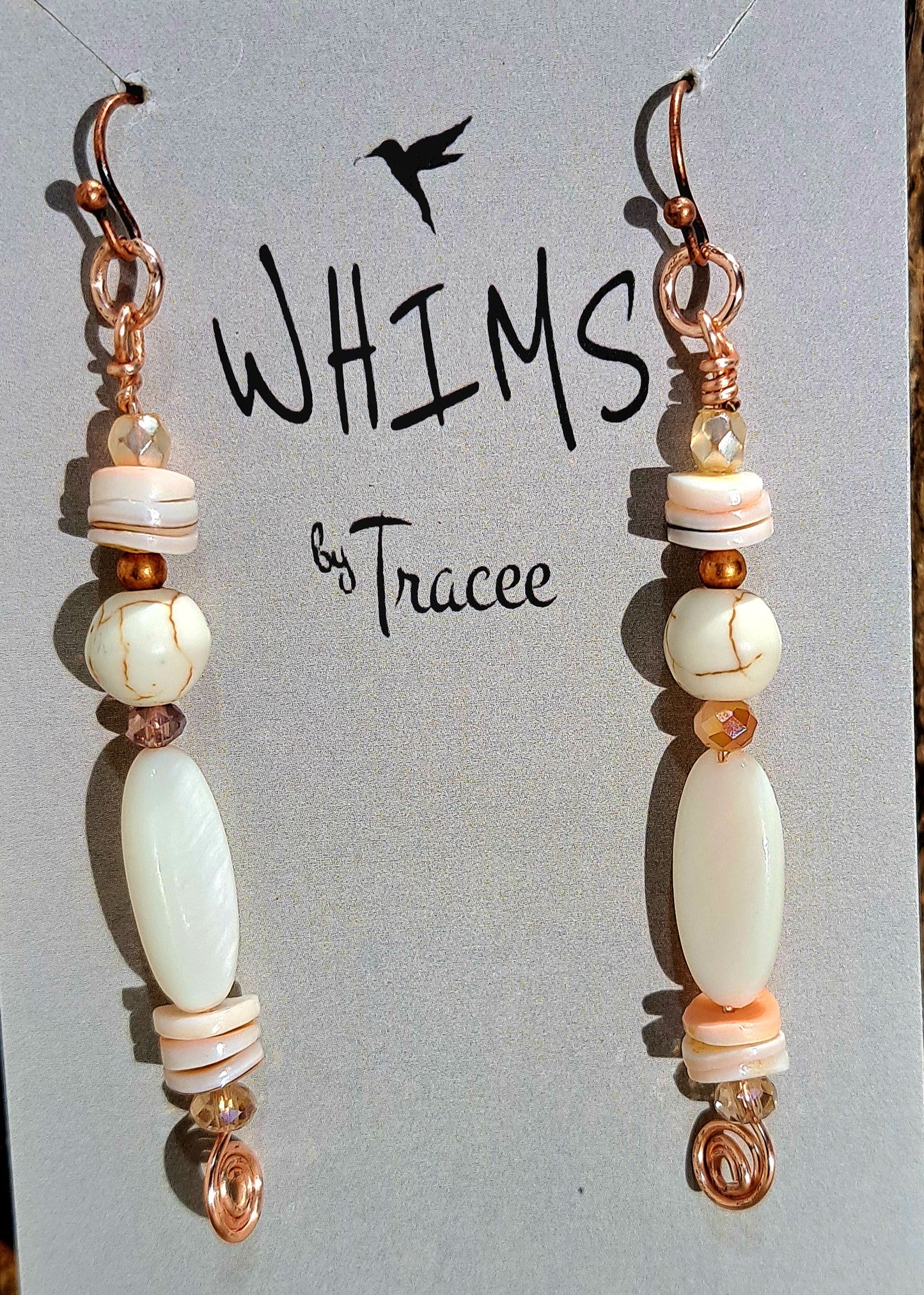 Ladies rose gold earrings with mother of pearl and abalone shell heishi beads.