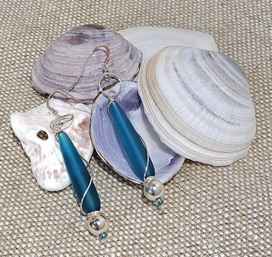 Ladies blue Sea glass drop earrings with silver wire wrapping.