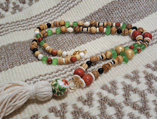 Ladies beach inspired tassel necklace with sea glass accents.