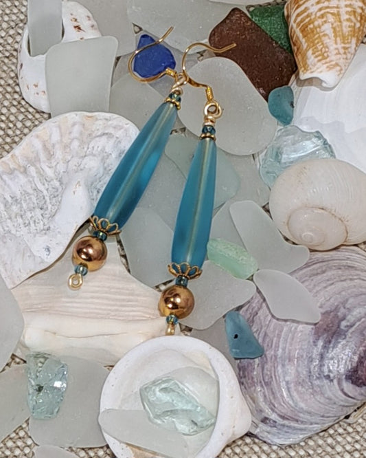 Ladies pale blue drop sea glass earring with gold bead and filigree.