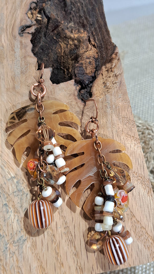 Ladies caramel acetate leaf earrings with vintage beads and copper chain dangles.
