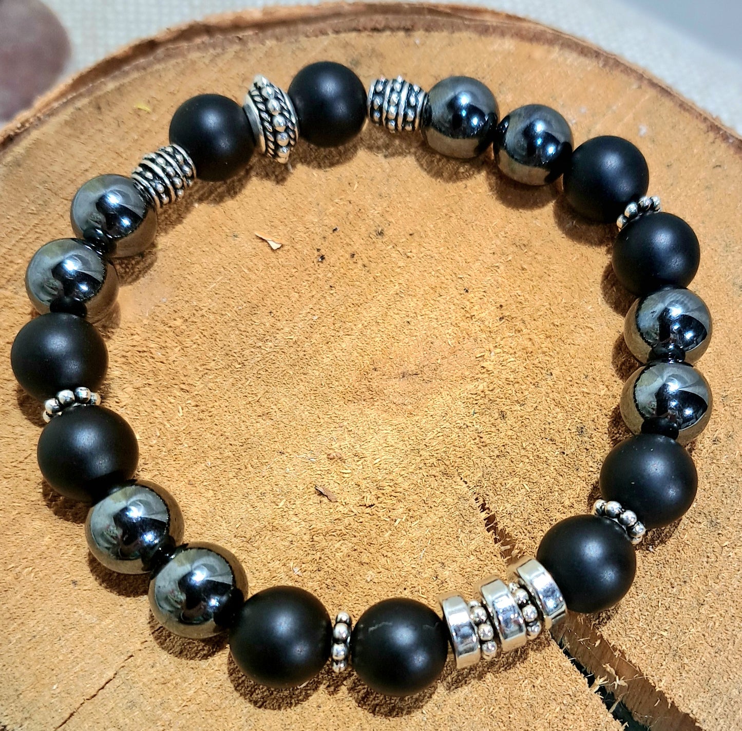 Mens stretch bracelet of onyx, hematite and steel.