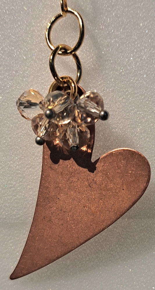 Ladies Copper heart earrings with crystals.