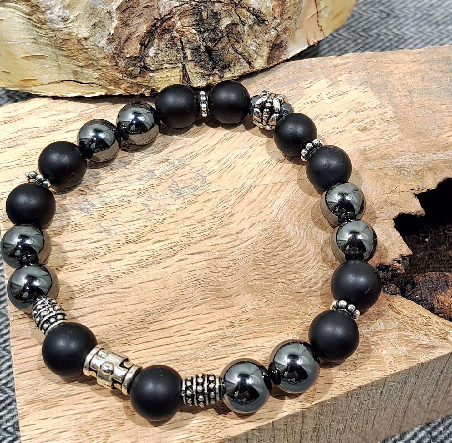 Mens stretch bracelet of hematite, matte black onyx and steel spacers