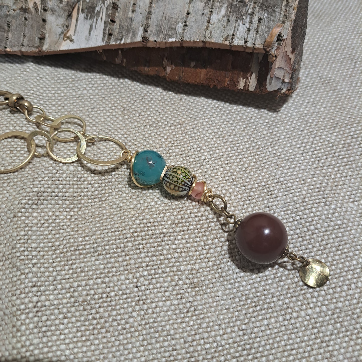 Brass varied link necklace with unusual bead combination.