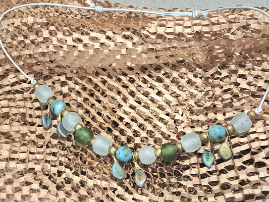 Ladies African recycled glass large bead necklace strung with pale sea green leather adjustable strap.