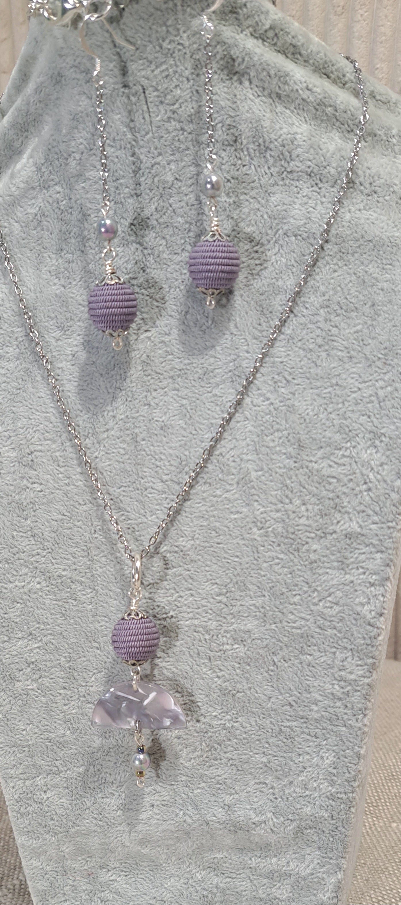 Mauve earring and necklace set of braided cord bead and acetate and pearl focal.