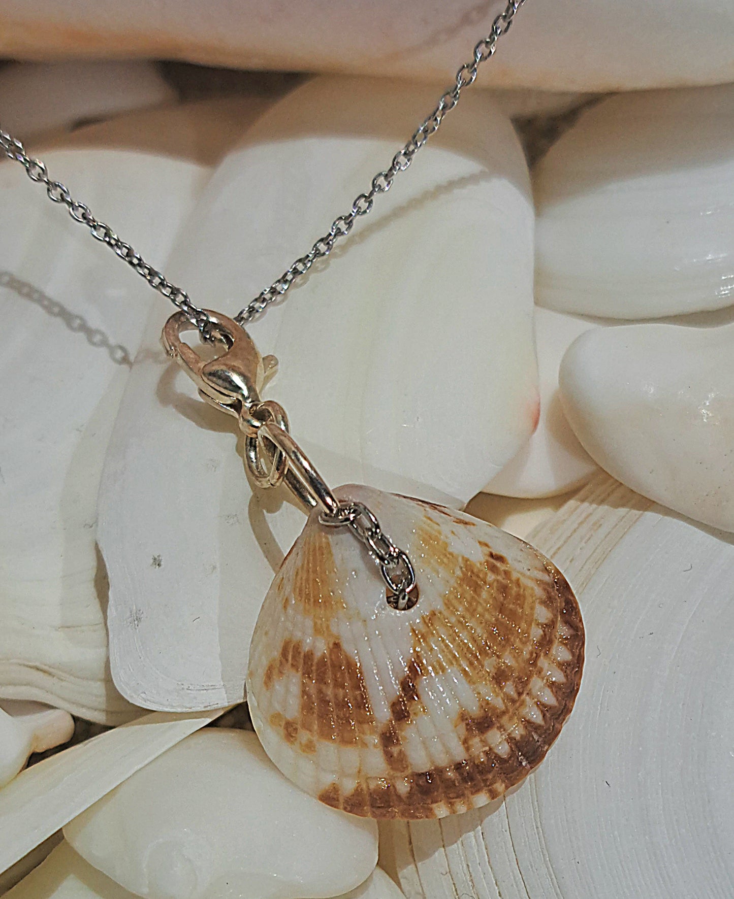 Sea Glass Shell pendant on gold chain with ivory and peach fresh water pearl dangles.