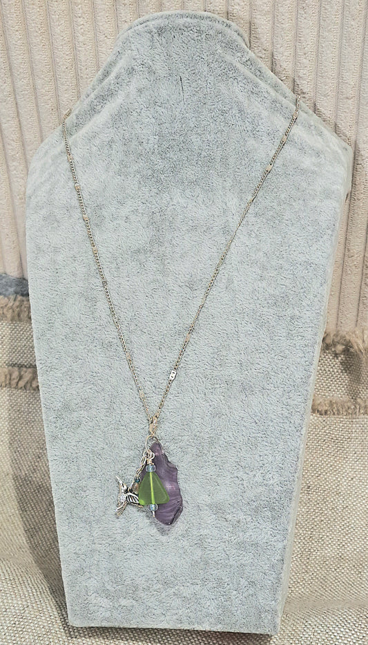 Hummingbird Charm and Purple strie Sea Glass necklace.