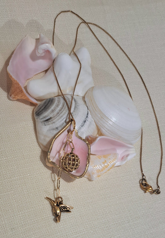 Conch Shell pendant necklace with Vintage gold bead and hummingbird,