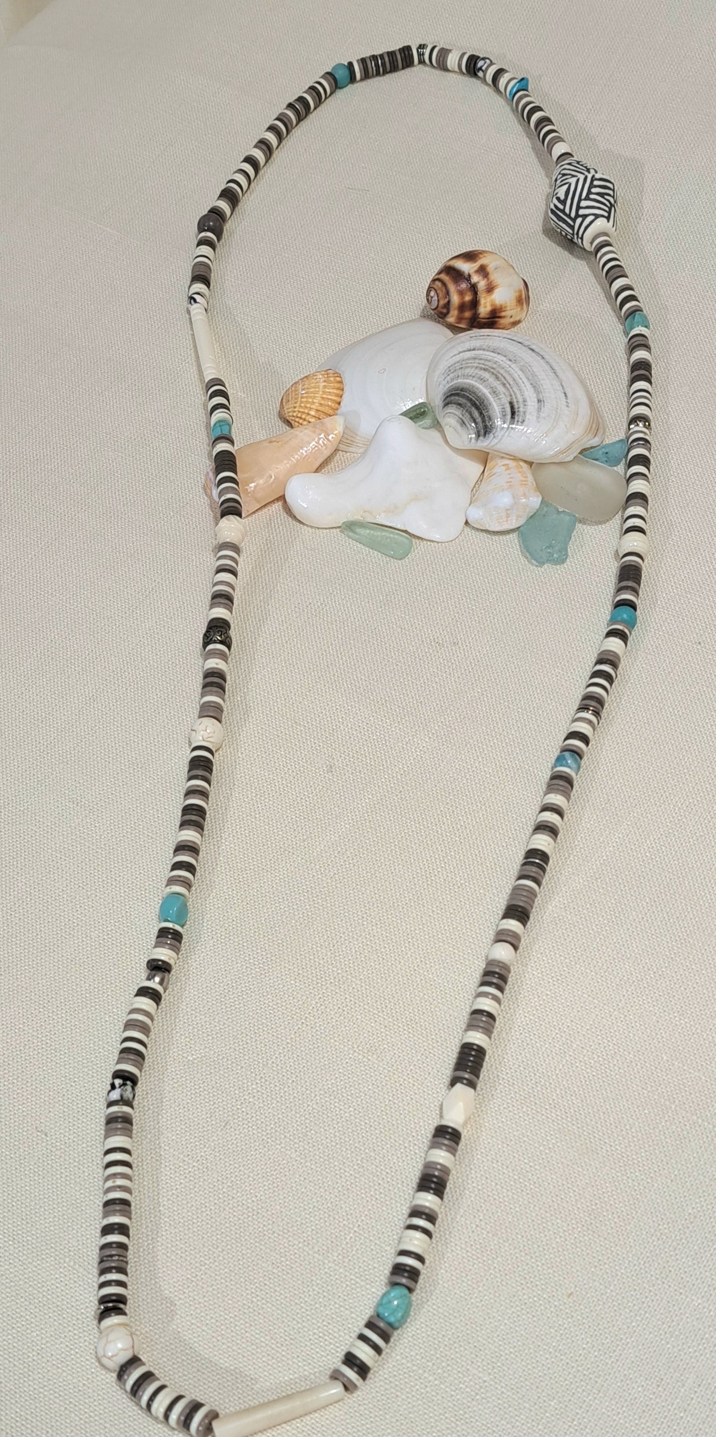 Heishi stretch necklace in neutrals with turquoise accents.
