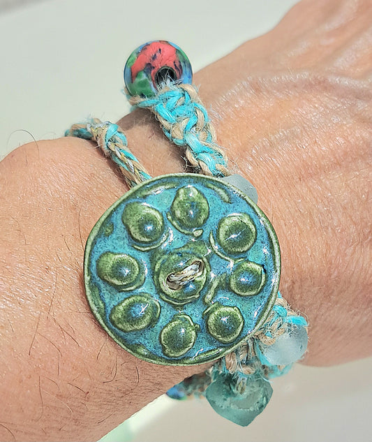 Ladies double wrap green/blue bracelet with large ceramic button and java glass.