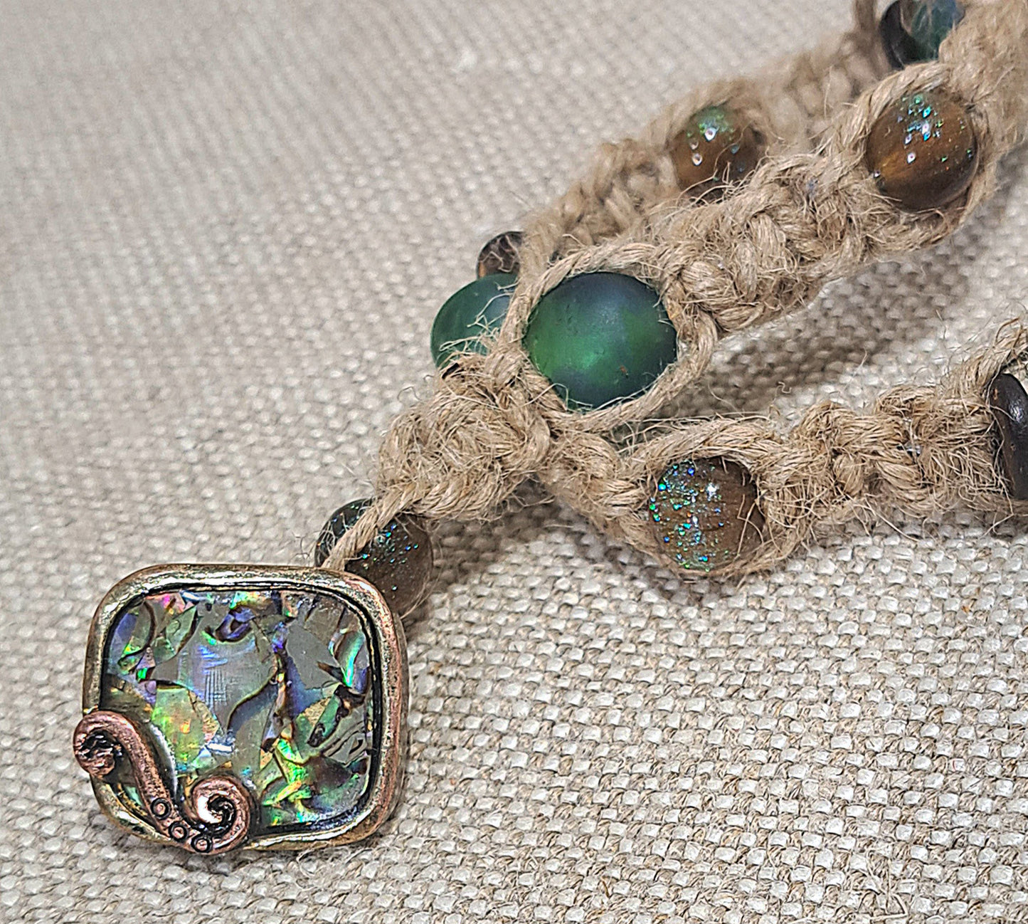 Green /Blue African recycled Glass and sparkled Storm Resin Jute wrapped bracelet.