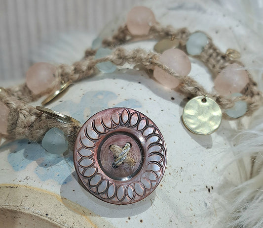 Jute wrap bracelet in pink and ice blue tones with unique Vintage button closure.