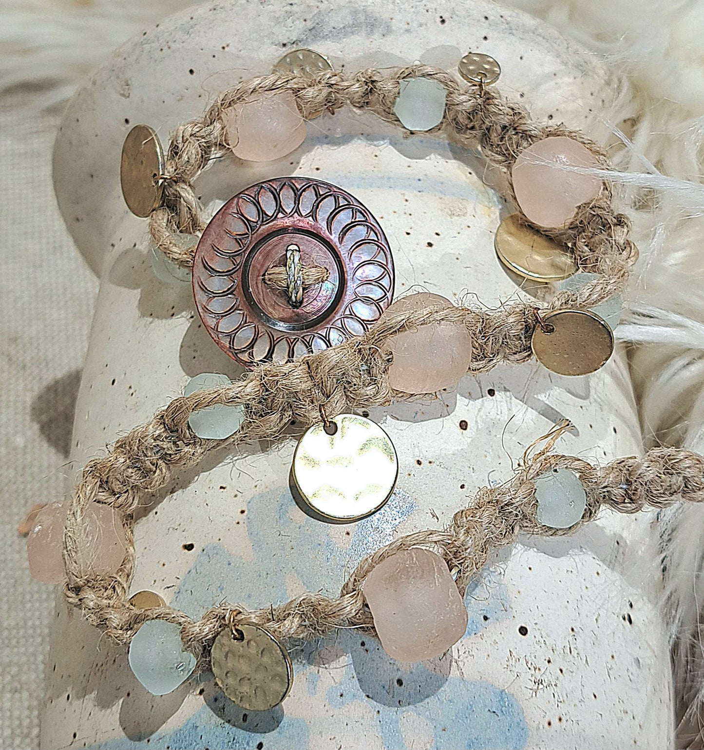 Jute wrap bracelet in pink and ice blue tones with unique Vintage button closure.