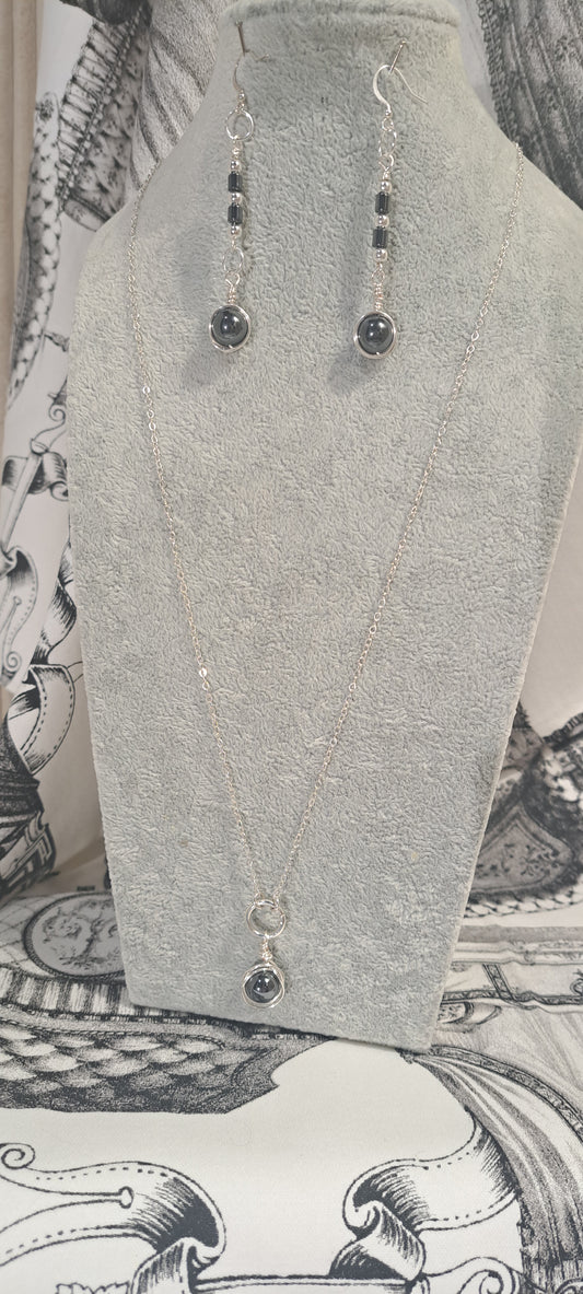 Ladies Hematite wire wrapped pendant on Silver chain.