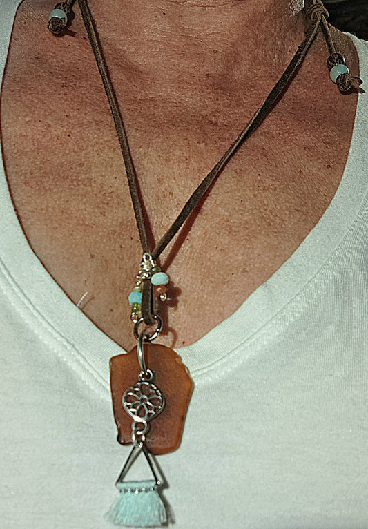 Brown Sea Glass and silver charm with tassel adjustable suede necklace.