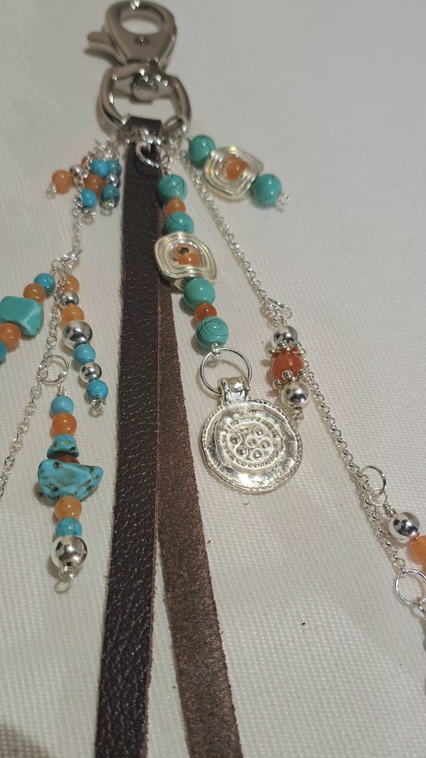 Dark Brown Leather and silver bag charm with carnelian and turquoise.