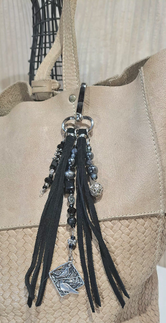 Black suede tassel bag charm with black onyx, black glass, and steel accent beads.