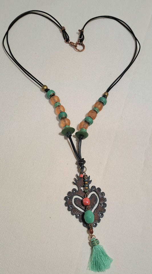 Rusted iron works heart pendant necklace on two toned leather.