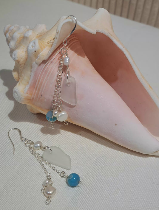 Etched Sea Glass necklace with fresh water pearls and sea blue gemstone beads on silver chain.