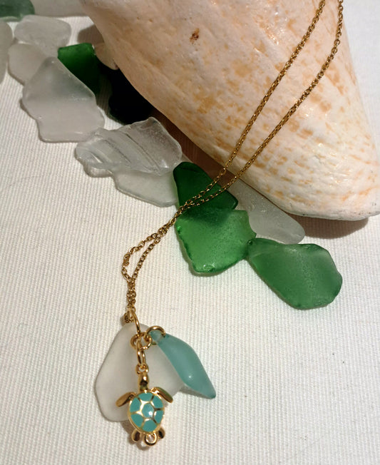 White sea glass and pale green swirl glass with co-ordinating green and gold enamel turtle.