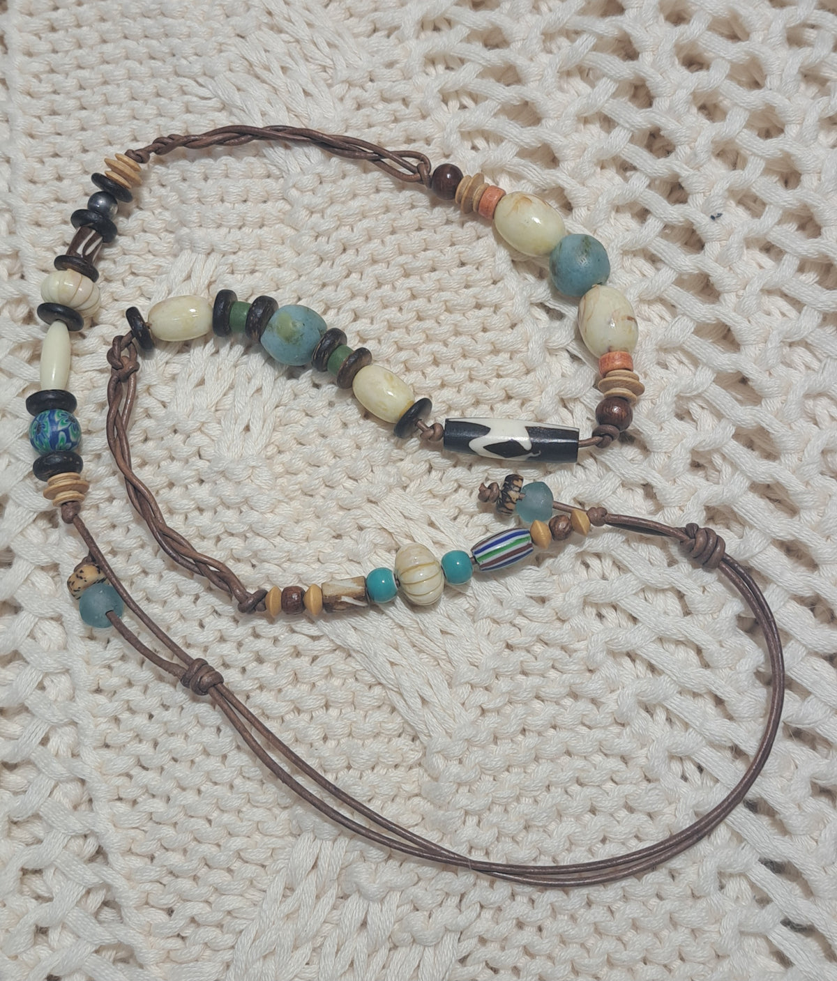 Natural leather necklace with braided leather and multi coloured beads