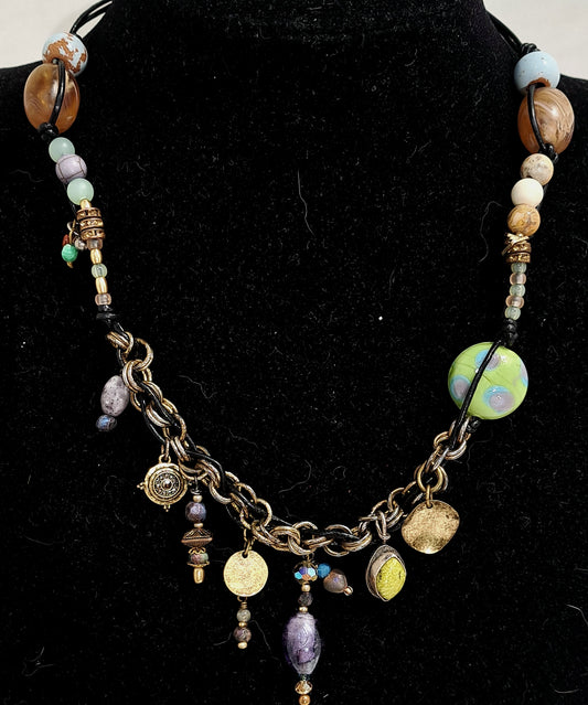 Black leather and mixed bead Bohemian inspired charm necklace.