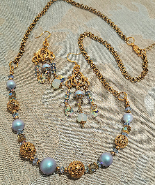 Ladies Swarovski blue pearl and vintage gold necklace and earring set.
