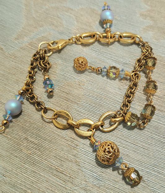 Ladies  varied gold chain and Swarovski blue pearl and vintage bead bracelet