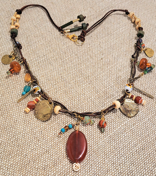 Ladies  brown leather and brass chain charm short necklace.