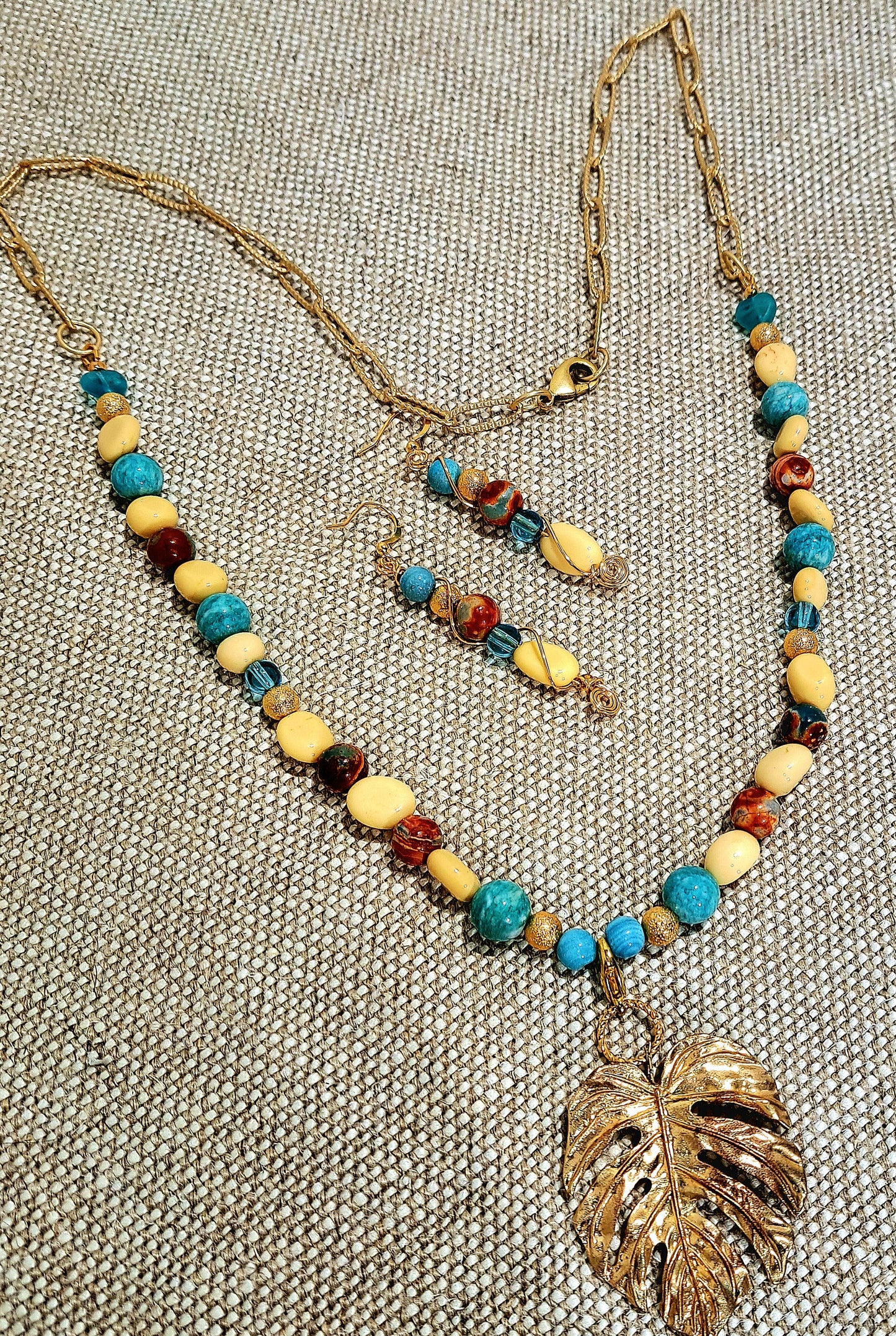Ladies Multi bead on gold paperclip chain with large gold leaf focal and earrings set