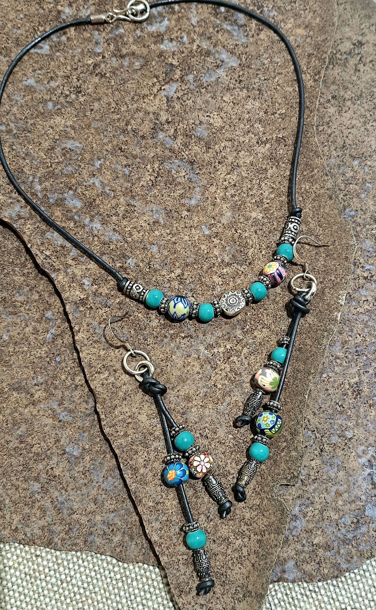 Ladies grey leather short necklace and earrings with polymer beads