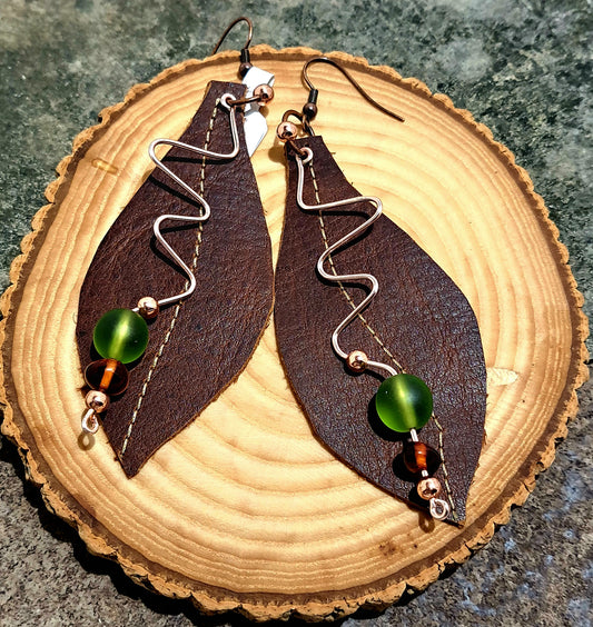 Ladies brown leather leaf shaped earrings with Zigzag rose gold wire.