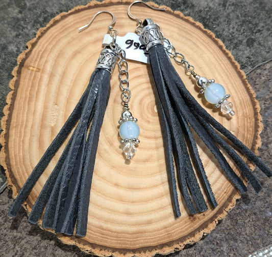 Ladies grey leather tassel earrings with chain and opaque glass balls.