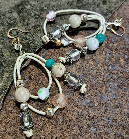 Ladies ivory leather cord looped and decorated with a mix of glass beads
