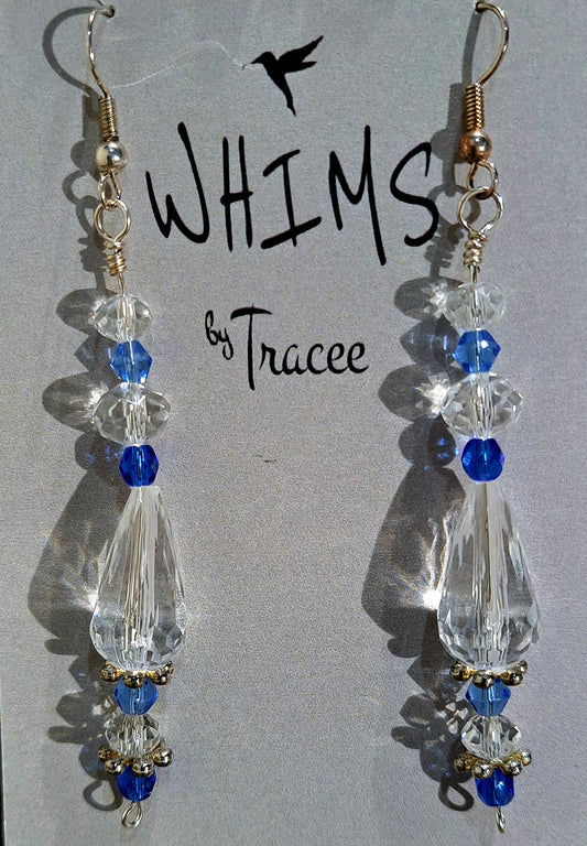 Ladies tear drop crystal chandelier earrings with blue crystal accents.