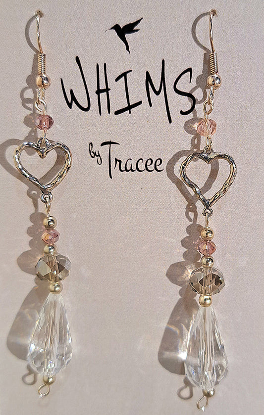 Ladies tear drop crystal and etched heart dangle earrings on silver plate.