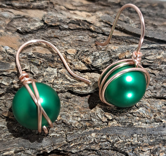 Ladies emerald green Swarovski pearl earring with Rose gold wire.