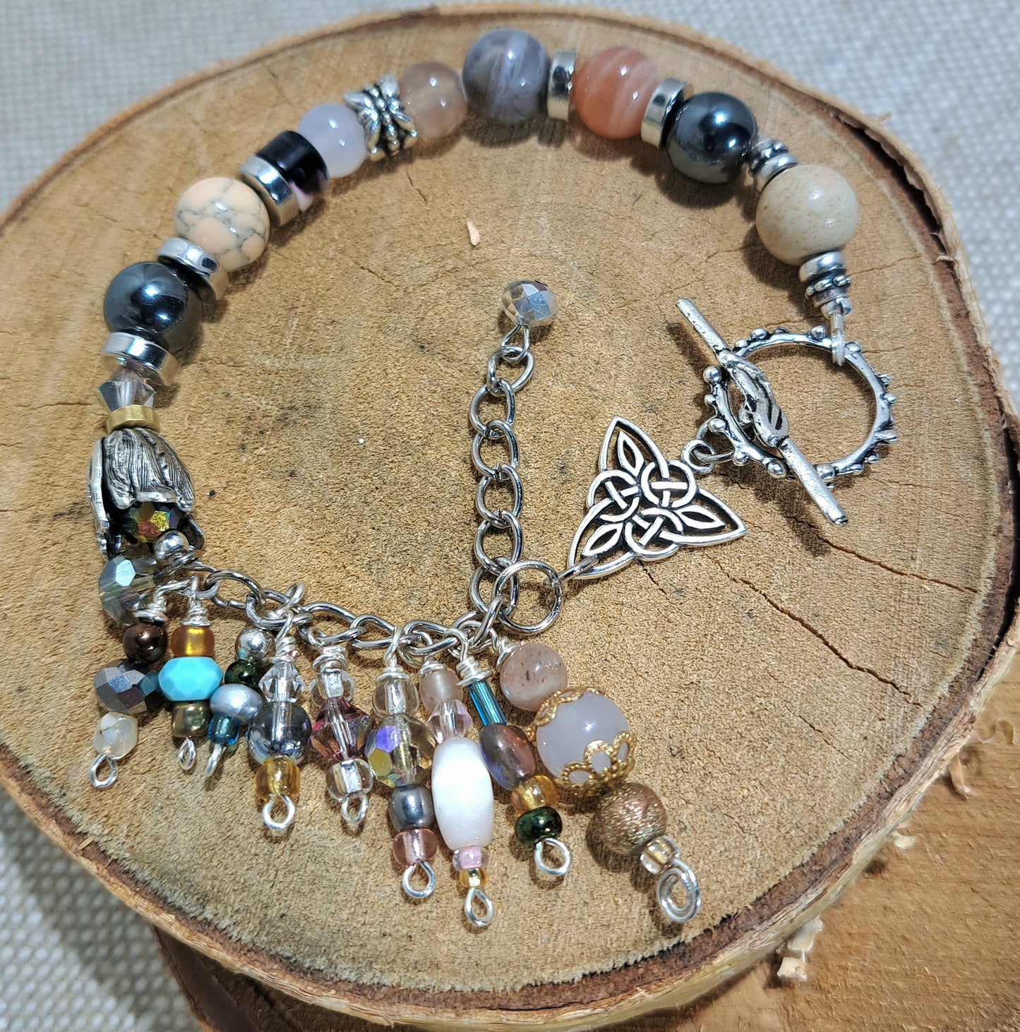 Ladies mixed gem stone beaded bracelet with steel Irish knot charm.