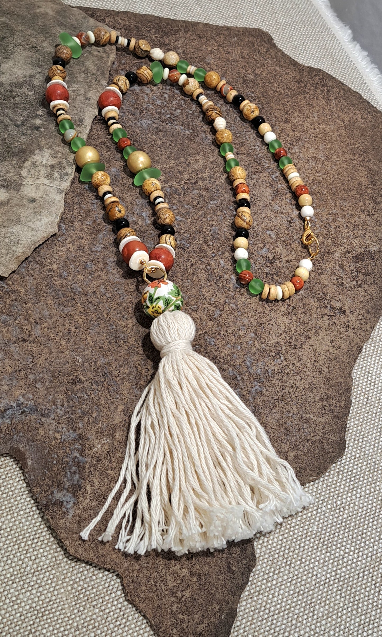 Ladies beach inspired tassel necklace with sea glass accents.