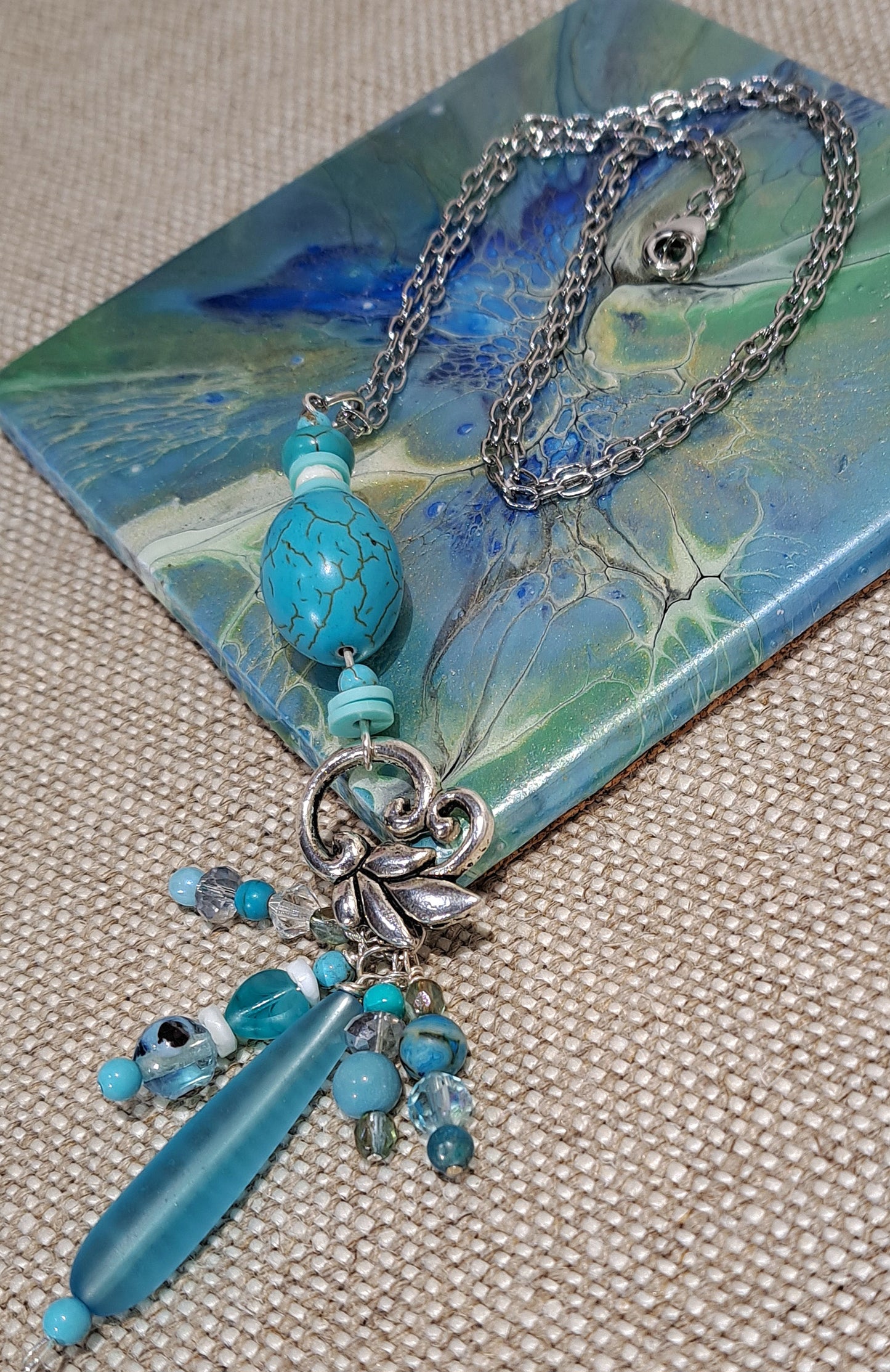 Ladies turquoise focal necklace on steel chain with Sea Glass and steel charm features