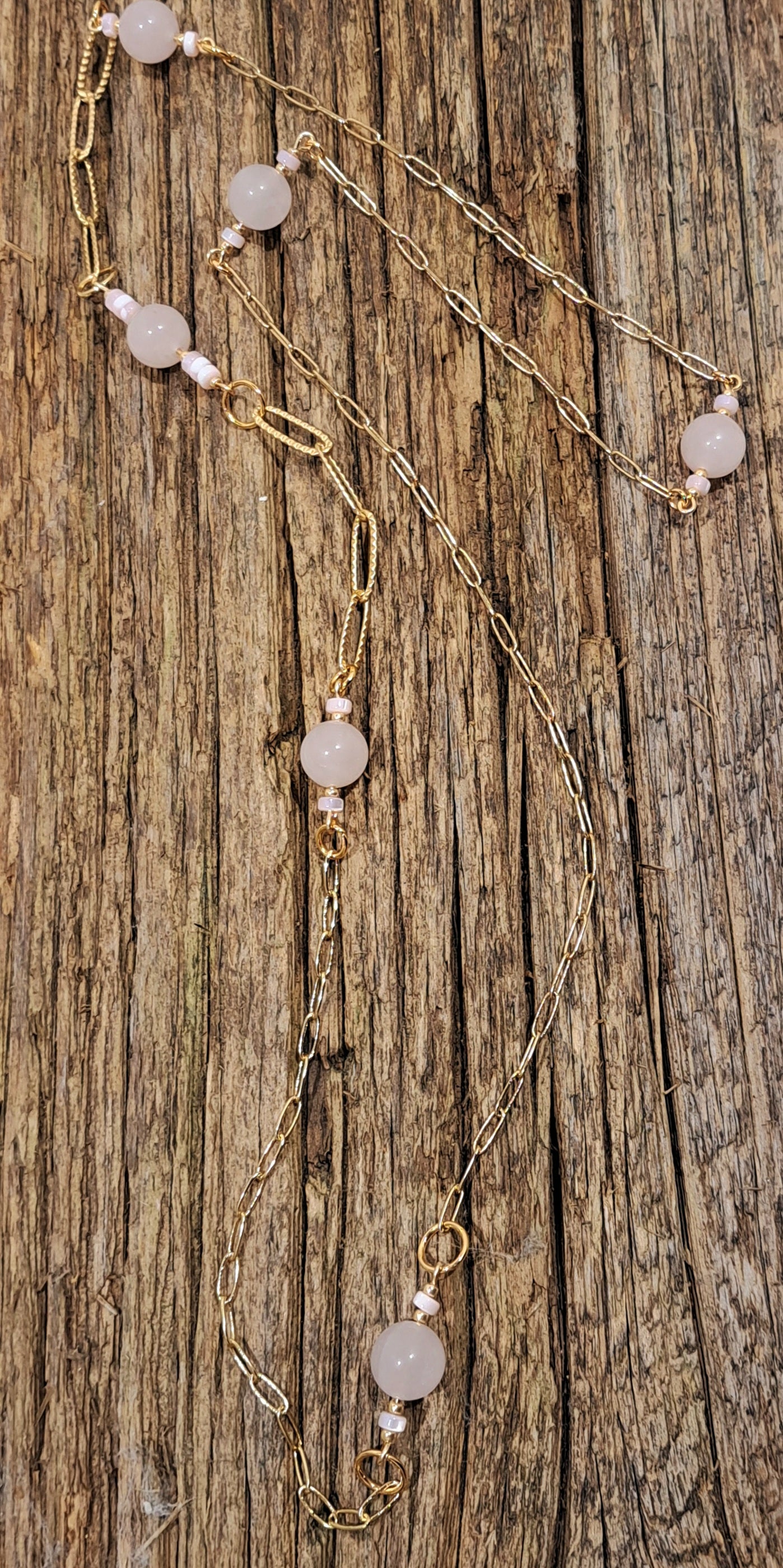 Ladies  necklace with Rose Quartz beads suspended amongst gold plated paperclip style chain.